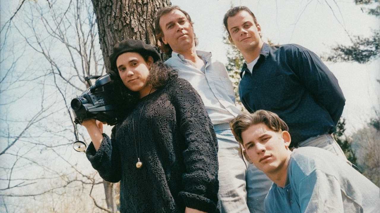 a teacher and students with a video camera